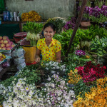 A girl selling flowers at Bago Market